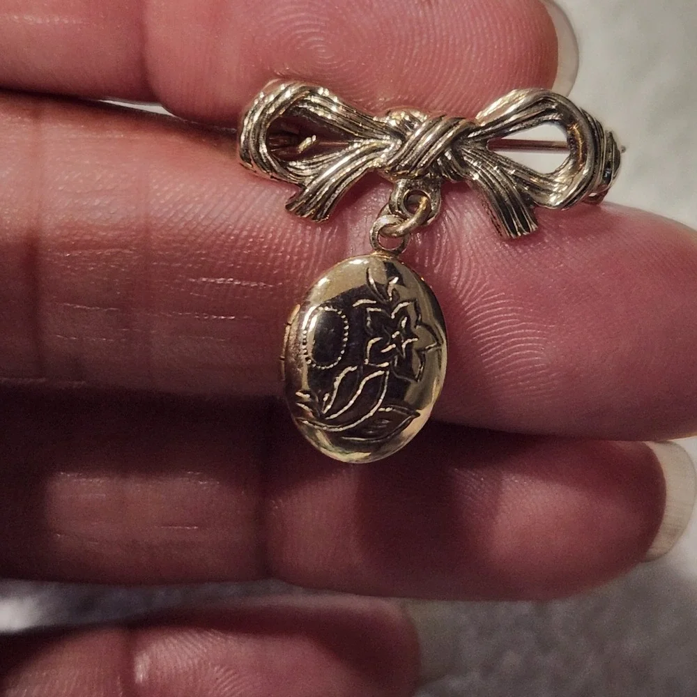Vintage Gold Tone Bow Brooch with Engraved Floral Oval Dangle Locket Pin